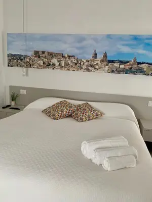 Letto o letti in una camera di Il Canale Design House