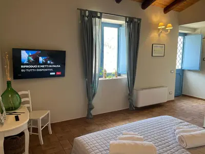 Letto o letti in una camera di Masseria Santacatrini