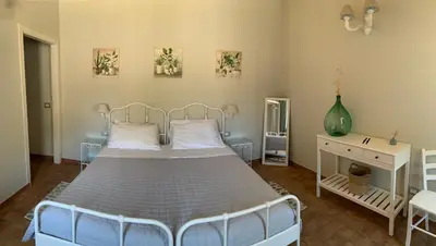 Letto o letti in una camera di Masseria Santacatrini