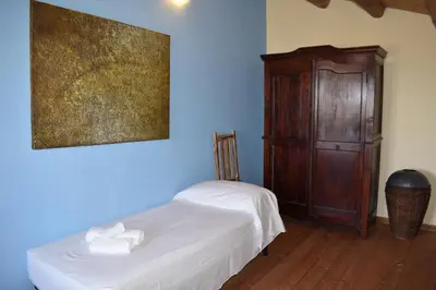 Letto o letti in una camera di Agriturismo Il Ranch