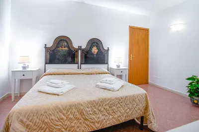 Letto o letti in una camera di Nuovo Castello Crisilio