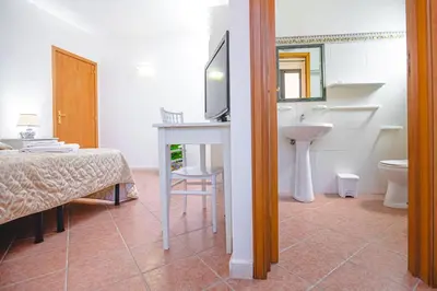 Letto o letti in una camera di Nuovo Castello Crisilio