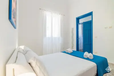 Letto o letti in una camera di LE 4 PERLE Apartments