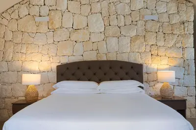 Letto o letti in una camera di Villa del Mito
