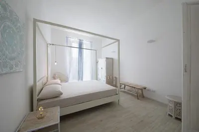 Letto o letti in una camera di AGATOCLEY, ai piedi di Ortigia