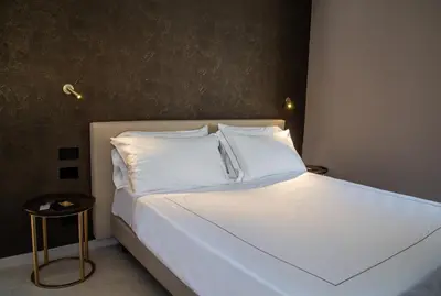 Letto o letti in una camera di Palazzo Salomone
