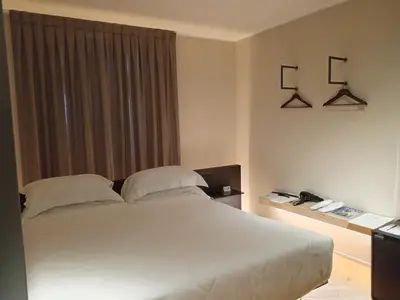 Letto o letti in una camera di Palazzo Salomone