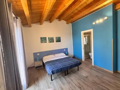 Letto o letti in una camera di alex rooms