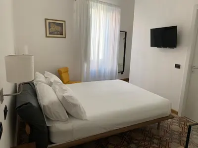 Letto o letti in una camera di AMECASA