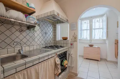 Cucina o angolo cottura di Cozy's house nel cuore della città