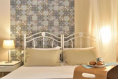 Letto o letti in una camera di Villa Giannina