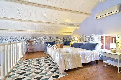 Letto o letti in una camera di Villa Giannina