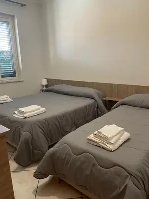 Letto o letti in una camera di Airport Tourist's House