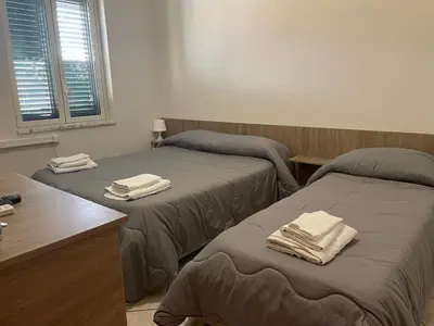 Letto o letti in una camera di Airport Tourist's House