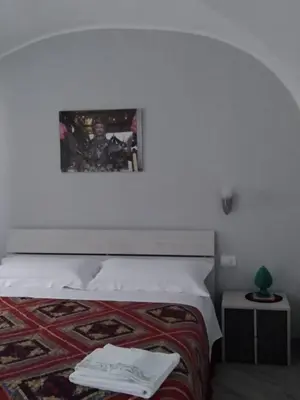 Letto o letti in una camera di Tourist House La Castellana