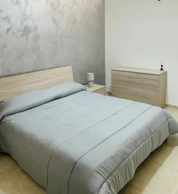 Letto o letti in una camera di Casa Vacanze San Nicolò