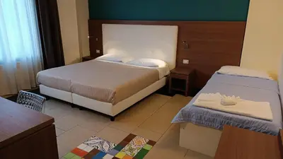 Letto o letti in una camera di Hotel Don Giovanni