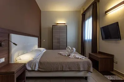 Letto o letti in una camera di Hotel Don Giovanni