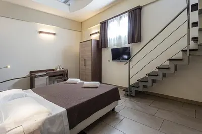 Letto o letti in una camera di Hotel Don Giovanni
