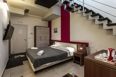 Letto o letti in una camera di Hotel Don Giovanni