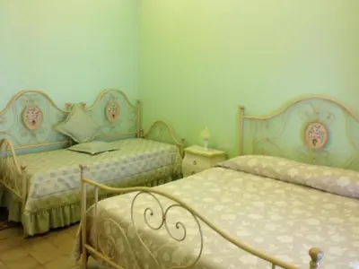 Letto o letti in una camera di Al Duomo Inn