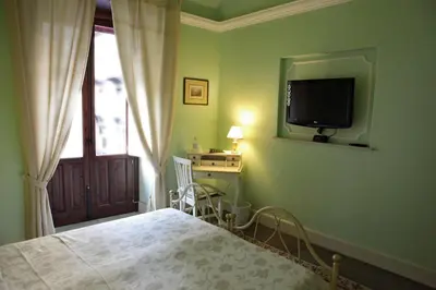 Letto o letti in una camera di Al Duomo Inn