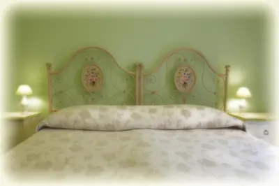 Letto o letti in una camera di Al Duomo Inn