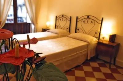 Letto o letti in una camera di Al Duomo Inn