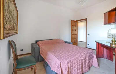 Letto o letti in una camera di Bellavista