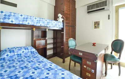 Letto o letti in una camera di Bellavista