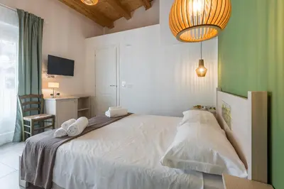Letto o letti in una camera di Il Baiocco -Ibla Charme Rooms
