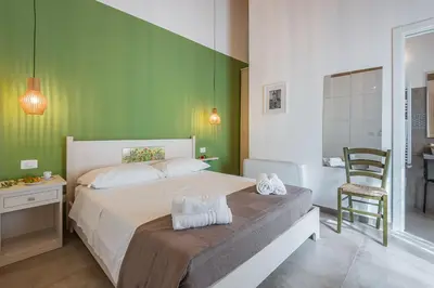 Letto o letti in una camera di Il Baiocco -Ibla Charme Rooms