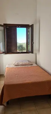 Letto o letti in una camera di Villa Andrea San Lorenzo