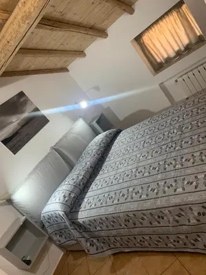 Letto o letti in una camera di Rooms Teatro Greco