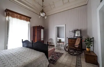 Letto o letti in una camera di Palazzo Degli Antoci