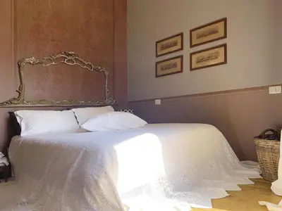 Letto o letti in una camera di Il Salotto di Maria Pia