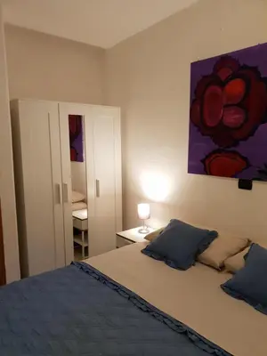 Letto o letti in una camera di Rooms in the Beach