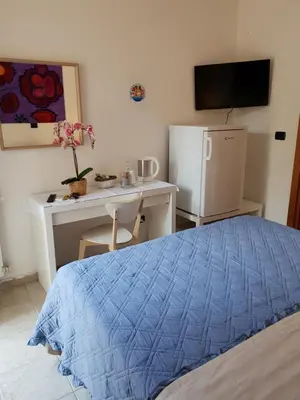 Letto o letti in una camera di Rooms in the Beach