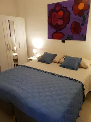 Letto o letti in una camera di Rooms in the Beach