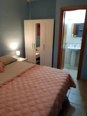 Letto o letti in una camera di Rooms in the Beach