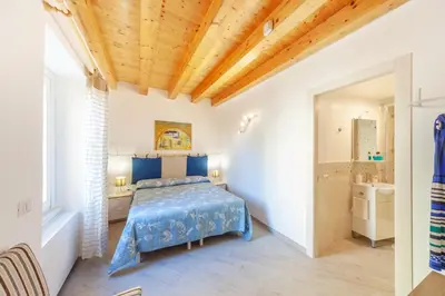 Letto o letti in una camera di GuestHost - La Terrazza sul Tempio di Apollo