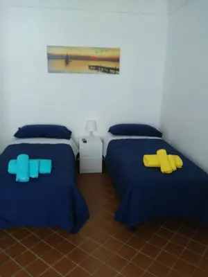 Letto o letti in una camera di B&B Piazza San Benedetto