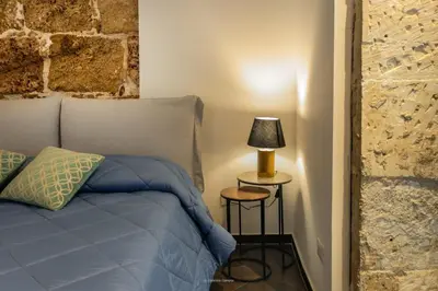 Letto o letti in una camera di GARIBALDI MAISON DE CHARME