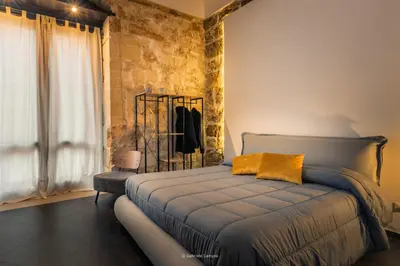 Letto o letti in una camera di GARIBALDI MAISON DE CHARME