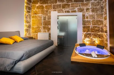 Letto o letti in una camera di GARIBALDI MAISON DE CHARME