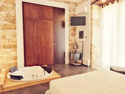 Letto o letti in una camera di GARIBALDI MAISON DE CHARME
