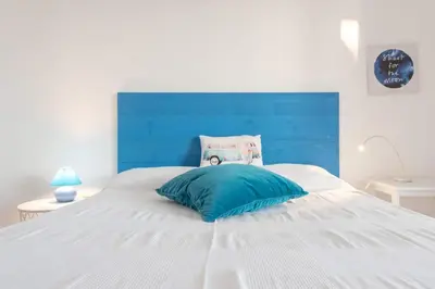Letto o letti in una camera di ISULATRAVEL - Blu Mediterraneo House