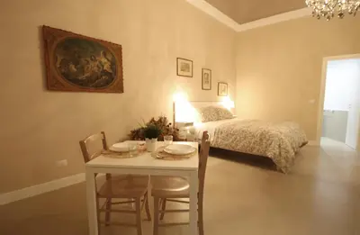 Letto o letti in una camera di Dimora Porta Garibaldi