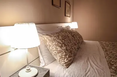 Letto o letti in una camera di Dimora Porta Garibaldi