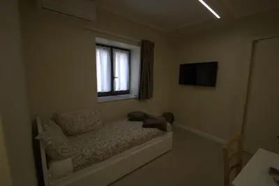 Letto o letti in una camera di Dimora Porta Garibaldi